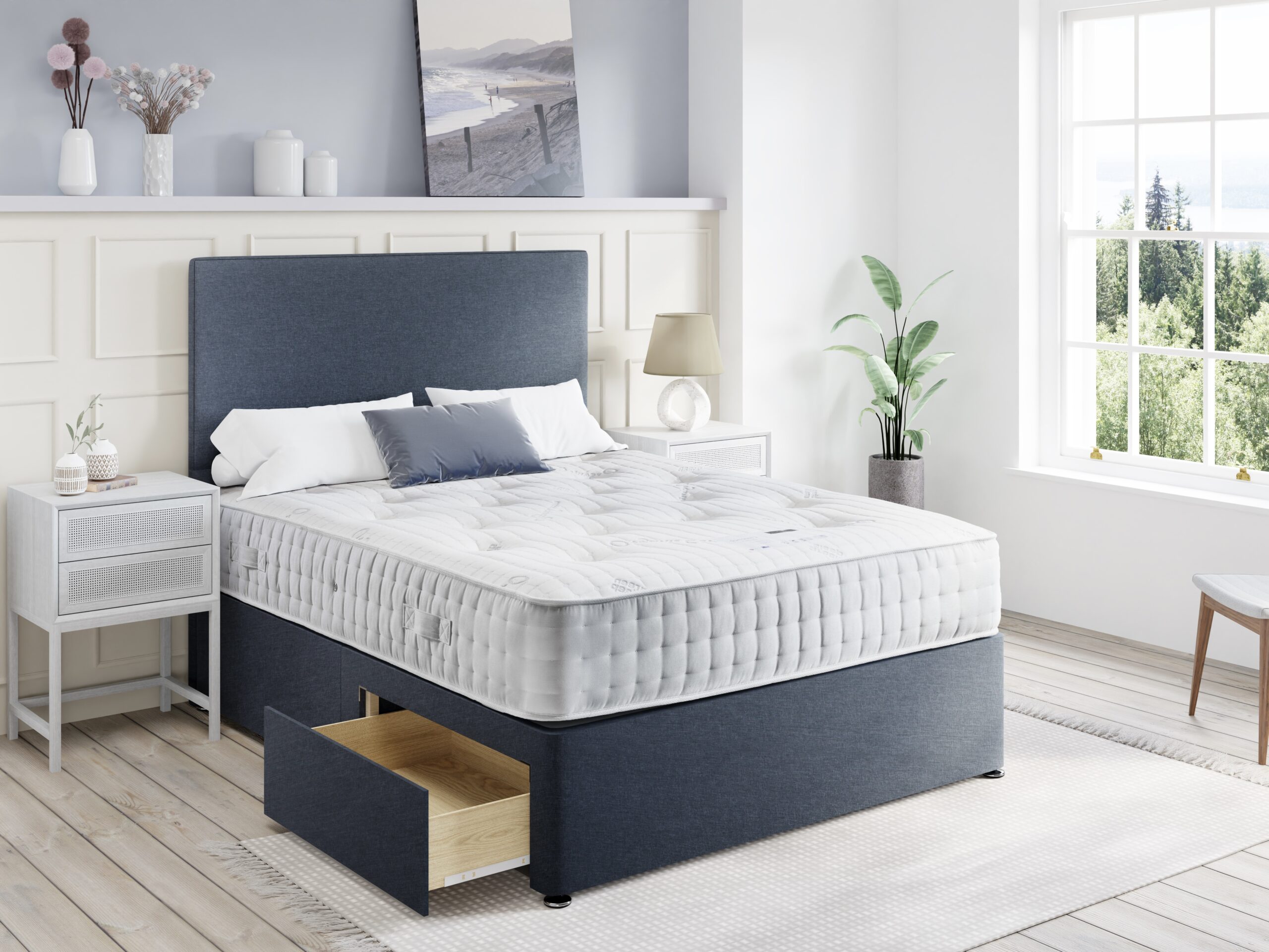 Clarence mattress on a navy drawer divan with a matching headboard