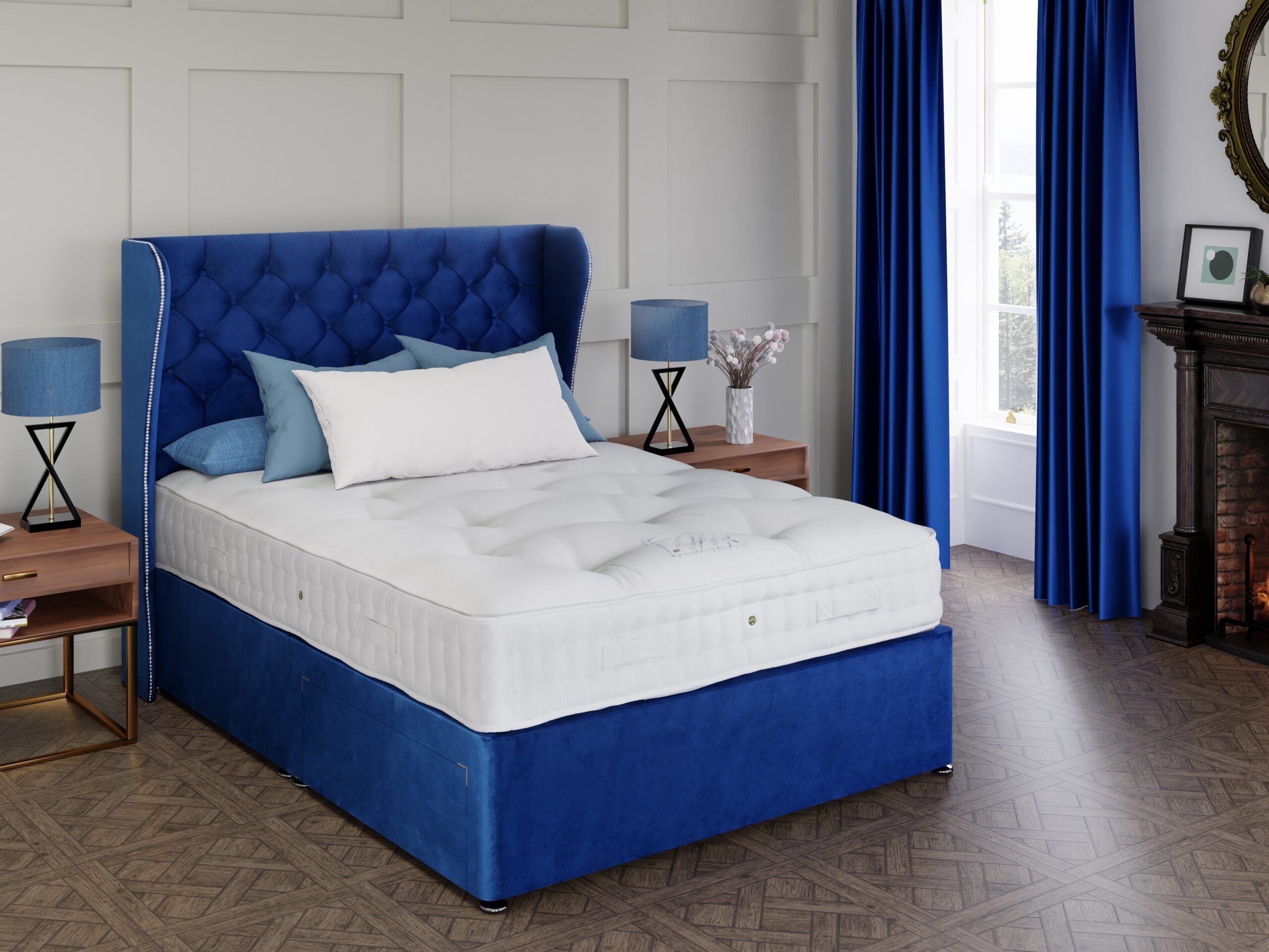 Windermere mattress on a blue velvet divan with a winged headboard